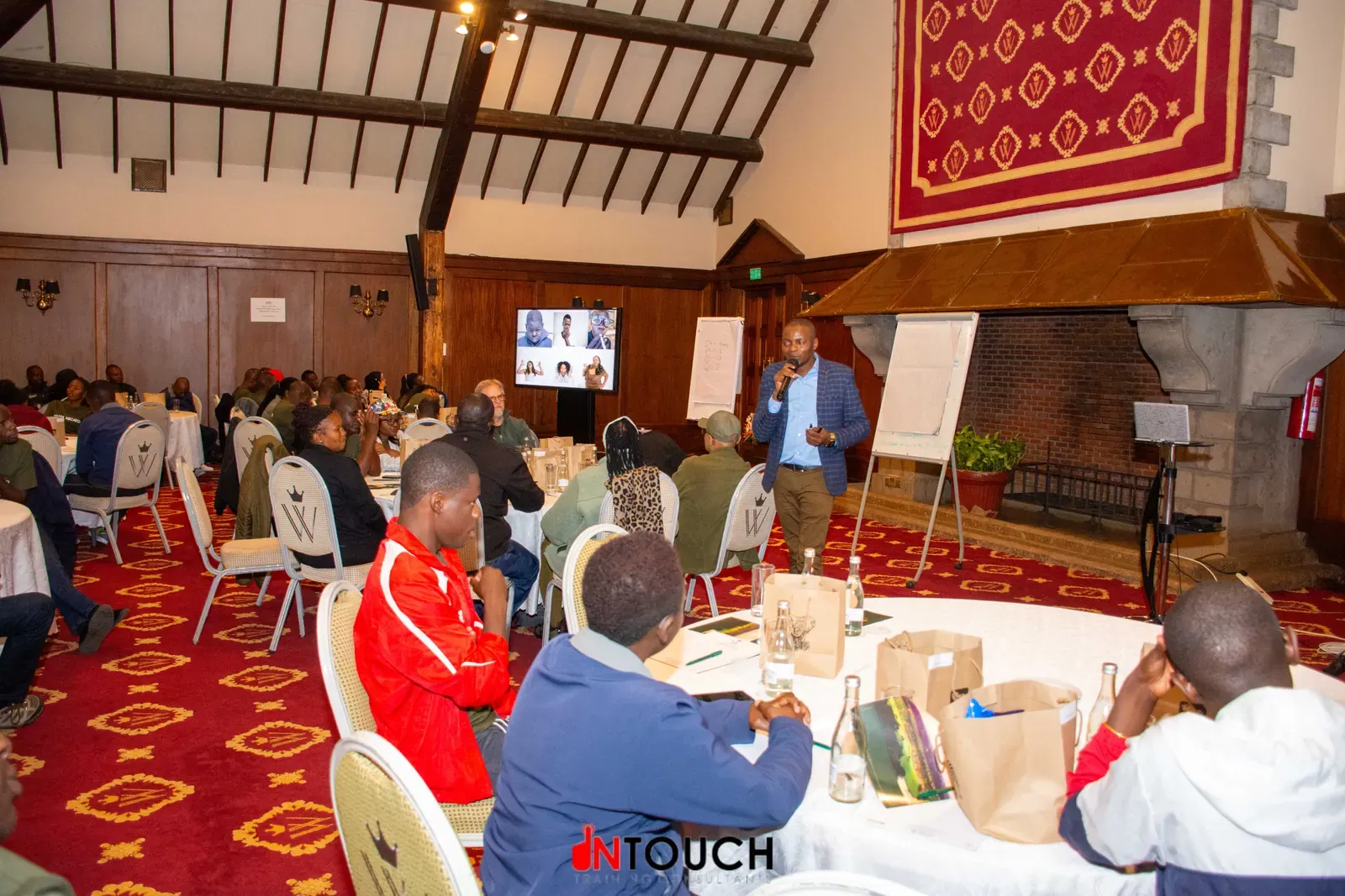 Participants and facilitators in an indoor workshop